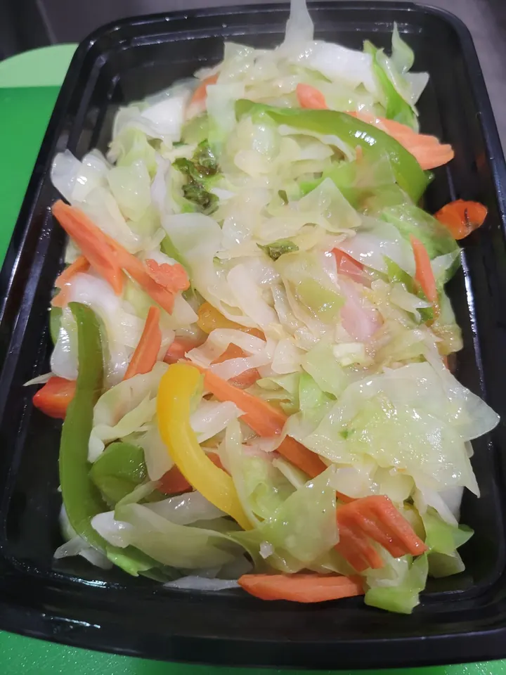 Steamed cabbage, carrots, and bell peppers